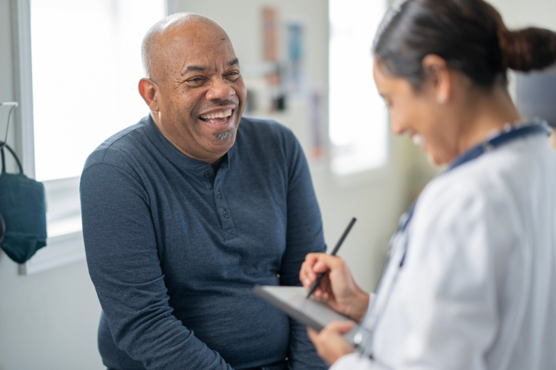 Senior man at the doctor's office talking with his doctors