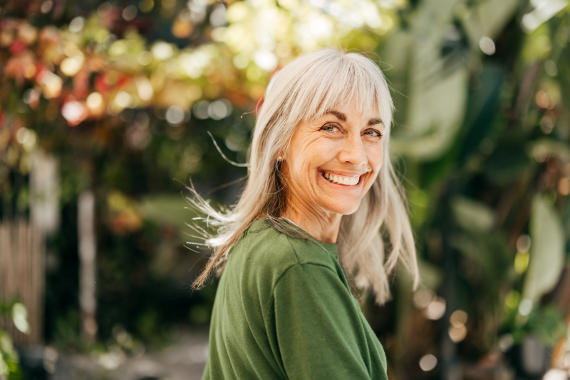 Senior woman outside smiling