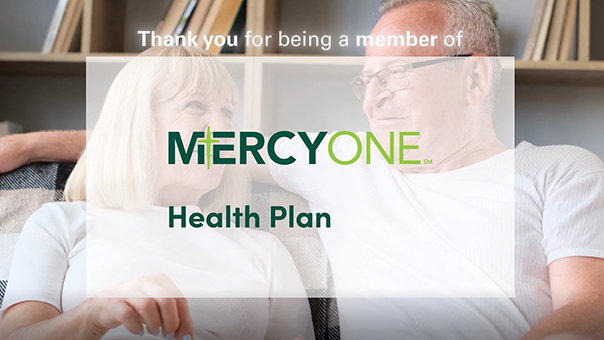 MercyOne Health Plan logo over a senior couple sitting on a couch